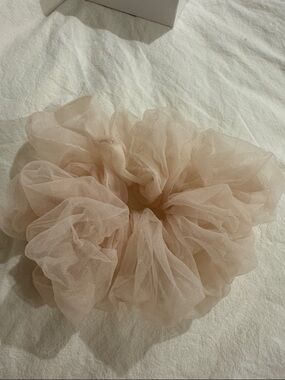 Oversized pink organza scrunchie.